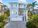 Inviting two-story home with a paved driveway and a two-car garage at 12917 42Nd W Ter, Cortez, FL 34215
