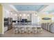 Bright kitchen island with seating, stainless steel appliances, and open floor plan at 12917 42Nd W Ter, Cortez, FL 34215
