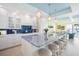 Bright kitchen with a large island, seating, and open view into the living room and of the water at 12917 42Nd W Ter, Cortez, FL 34215