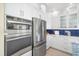 Stainless steel oven, microwave, and refrigerator in a bright kitchen with white cabinets at 12917 42Nd W Ter, Cortez, FL 34215