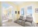 Comfortable sitting room adjacent to bedroom with water views and plush seating at 12917 42Nd W Ter, Cortez, FL 34215
