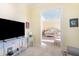 Sitting area with television leads to the bedroom with ensuite bathroom at 12917 42Nd W Ter, Cortez, FL 34215