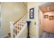 Staircase adjacent to an elevator; artwork adorns the walls at 12917 42Nd W Ter, Cortez, FL 34215