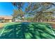 Community basketball court surrounded by trees, grass, and a playground at 20032 Sancraft Ave, Port Charlotte, FL 33954