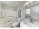 Bathroom featuring a shower-tub combo, sink vanity with mirror, and neutral walls at 20032 Sancraft Ave, Port Charlotte, FL 33954