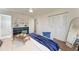 Bright bedroom featuring a cozy bed, stylish dresser, and ample closet space for a comfortable living experience at 20032 Sancraft Ave, Port Charlotte, FL 33954