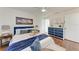 Charming bedroom with hardwood floors, a plush bed, and stylish blue accents for a cozy and inviting atmosphere at 20032 Sancraft Ave, Port Charlotte, FL 33954
