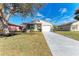 Charming single-Gathering home with an attached one car garage and large lawn at 20032 Sancraft Ave, Port Charlotte, FL 33954