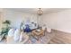Bright living room featuring stylish decor, wood floors, modern lighting, and comfortable seating at 20032 Sancraft Ave, Port Charlotte, FL 33954