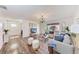 Bright living room with modern decor, wood floors, and views into the backyard at 20032 Sancraft Ave, Port Charlotte, FL 33954