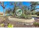 Community sign 'Oak Hollow Recreation Center' amidst landscaping at 20032 Sancraft Ave, Port Charlotte, FL 33954