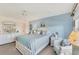 Bright bedroom with a view of the waterway, nautical décor, and a chest of drawers at 4350 Chatham Dr # E106, Longboat Key, FL 34228