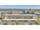 Spacious condominiums featuring covered parking with beautiful waterfront views and lush tropical landscaping at 4350 Chatham Dr # E106, Longboat Key, FL 34228