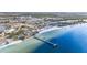 Aerial view of a beach, pier, and community at 559 Bahia Beach Blvd, Ruskin, FL 33570