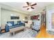 Inviting living room with comfortable seating and view into the kitchen at 559 Bahia Beach Blvd, Ruskin, FL 33570