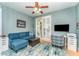 Comfortable living room with modern decor, hardwood floors and sliding glass doors at 559 Bahia Beach Blvd, Ruskin, FL 33570