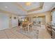 A bright breakfast nook adjacent to the kitchen and living area with outside views at 6334 Grand Oak Cir # 201, Bradenton, FL 34203