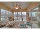 Enjoy the lake view from this light-filled sunroom with comfortable seating and stylish décor at 6334 Grand Oak Cir # 201, Bradenton, FL 34203