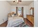 Bedroom with bright light coming in from the window and hardwood floors at 6814 Willowshire Way, Bradenton, FL 34212