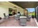 Cozy covered patio with a ceiling fan, offering a comfortable outdoor space for entertaining at 6814 Willowshire Way, Bradenton, FL 34212