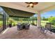 Inviting screened-in patio with brick flooring, outdoor furniture, and scenic views at 6814 Willowshire Way, Bradenton, FL 34212