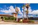 Community tennis center entrance features lush landscaping and well maintained courts at 6814 Willowshire Way, Bradenton, FL 34212
