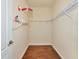 Empty walk-in closet with shelving and wood floors. Ready for your personal belongings at 6814 Willowshire Way, Bradenton, FL 34212
