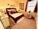 Cozy bedroom featuring a comfortable bed, decorative accents, and a relaxing ambiance at 7619 Teal Trace, Bradenton, FL 34203