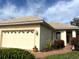 Charming single-story home with a tile roof, a well-manicured lawn and landscaping at 7619 Teal Trace, Bradenton, FL 34203