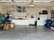 Spacious garage with ample storage, cabinets, and a utility sink at 7619 Teal Trace, Bradenton, FL 34203