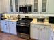 Close-up view of kitchen appliances with stainless steel range and microwave at 7619 Teal Trace, Bradenton, FL 34203
