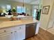 Bright open-concept kitchen with stainless steel appliances and a seamless flow into the living space at 7619 Teal Trace, Bradenton, FL 34203