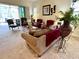 Cozy living room features comfortable seating, stylish decor, and sliding glass doors to a patio at 7619 Teal Trace, Bradenton, FL 34203