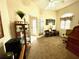 Well-lit home office featuring French doors, a ceiling fan, and a comfortable workspace at 7619 Teal Trace, Bradenton, FL 34203
