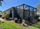 Back screened-in porch and yard providing a relaxing outdoor living space at 7619 Teal Trace, Bradenton, FL 34203