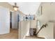 Hallway with tile flooring, natural light, and access to multiple rooms at 8059 Strasse Blvd, Punta Gorda, FL 33982