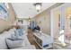 Bright living room with comfortable seating and stylish decor and decor, leading to an outdoor patio at 8059 Strasse Blvd, Punta Gorda, FL 33982