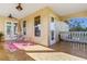 Covered patio with outdoor seating, ceiling fan, exterior windows and doors showcasing outdoor views at 8059 Strasse Blvd, Punta Gorda, FL 33982