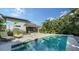 Backyard features a pool, patio, and lush landscaping, creating an ideal outdoor living space at 2434 Wood St, Sarasota, FL 34237