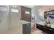 Modern bathroom featuring a soaking tub, walk-in shower, and double sinks with modern fixtures at 2434 Wood St, Sarasota, FL 34237