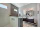 Sleek bathroom featuring double sinks, modern fixtures, and a stylish walk-in shower with glass partition at 2434 Wood St, Sarasota, FL 34237