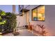 Stylish home entrance with modern accents, unique plants, a stone walkway, and a serene welcoming ambiance at 2434 Wood St, Sarasota, FL 34237