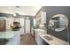 Modern kitchen design with white cabinetry, stainless steel appliances, and ample counter space at 2434 Wood St, Sarasota, FL 34237