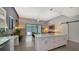 Bright kitchen featuring an island, access to the living area, and abundant natural light at 2434 Wood St, Sarasota, FL 34237