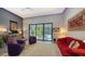 Bright living room with modern decor and sliding doors to a screened lanai with pool views at 2434 Wood St, Sarasota, FL 34237