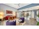 Open-concept living space includes a dining area, kitchen, and comfortable seating with outside access at 2434 Wood St, Sarasota, FL 34237