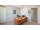 Office space showcasing wooden floors, a sleek desk, and contemporary decor at 2434 Wood St, Sarasota, FL 34237