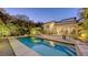 Inviting backyard pool with lush landscaping, lounge chairs, and a seamless indoor-outdoor living transition at 2434 Wood St, Sarasota, FL 34237