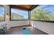 Enclosed porch area with black tile, open view, and space for exercise or relaxation at 2434 Wood St, Sarasota, FL 34237