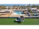 Beautiful waterfront property with a pool, tiki hut, and boat dock at 2762 W Vina Del Mar Blvd, St Pete Beach, FL 33706